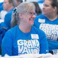 Woman looking off camera, smiling